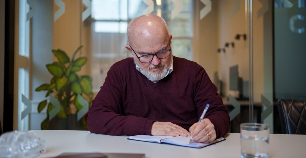 Mark Glover writing notes