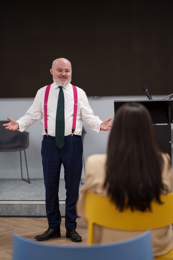 Mark Glover Talking to Woman